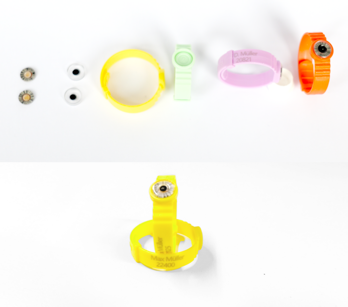 Das Bild zeigt Ringdosimeter der LPS, welche mit dem Klarnamen der zugehörigen Person versehen sind. Auch sind die einzelnen Bestandteile zu sehen.